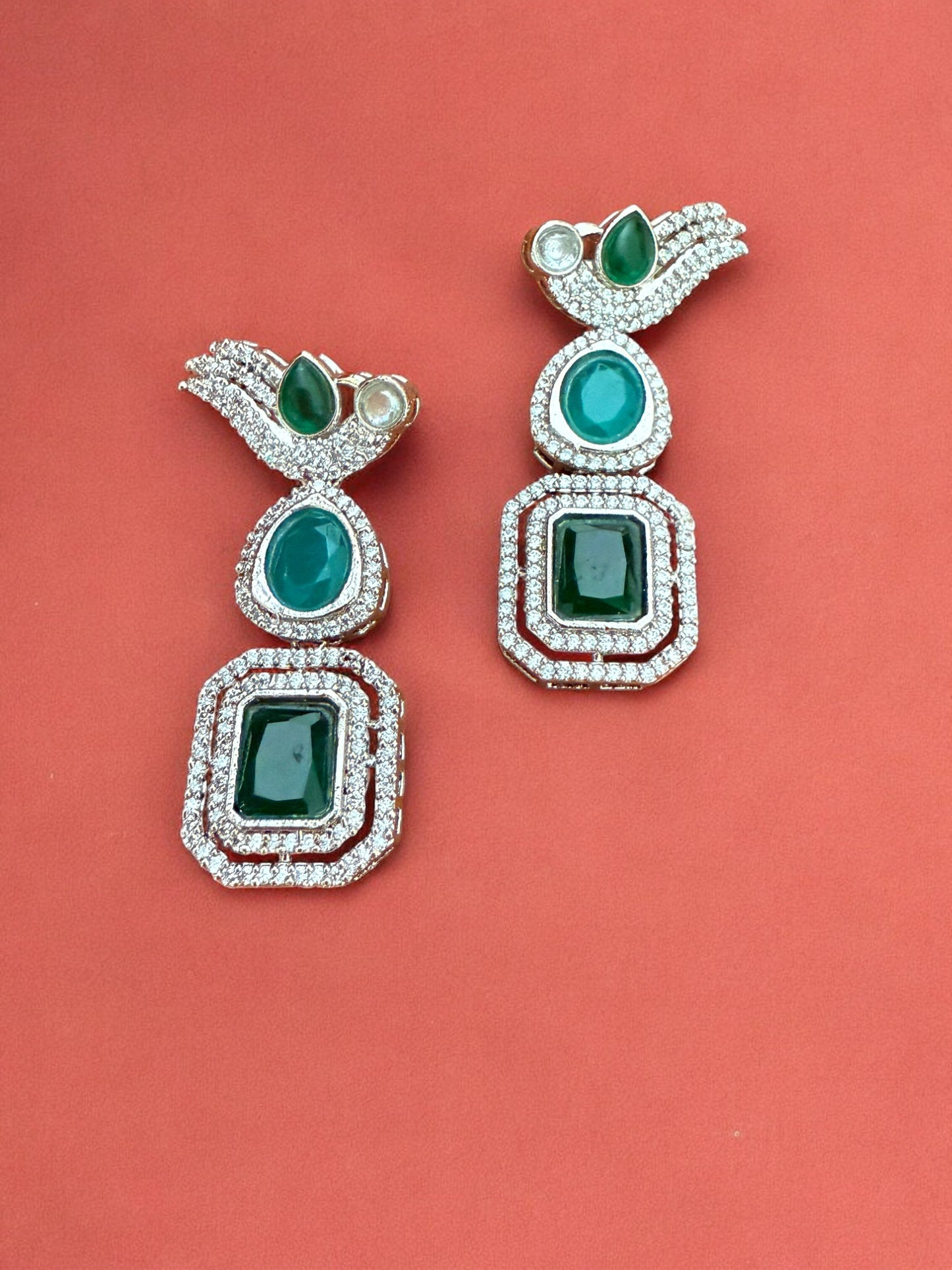 Silver Toned Cubic Zircon Earrings With Green Stones And Delicate Bird Motif Detailing