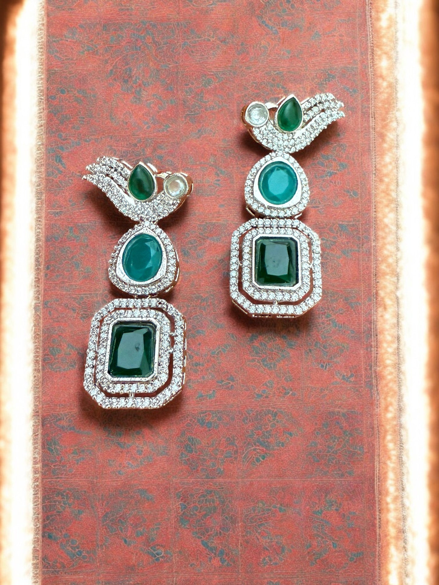 Silver Toned Cubic Zircon Earrings With Green Stones And Delicate Bird Motif Detailing