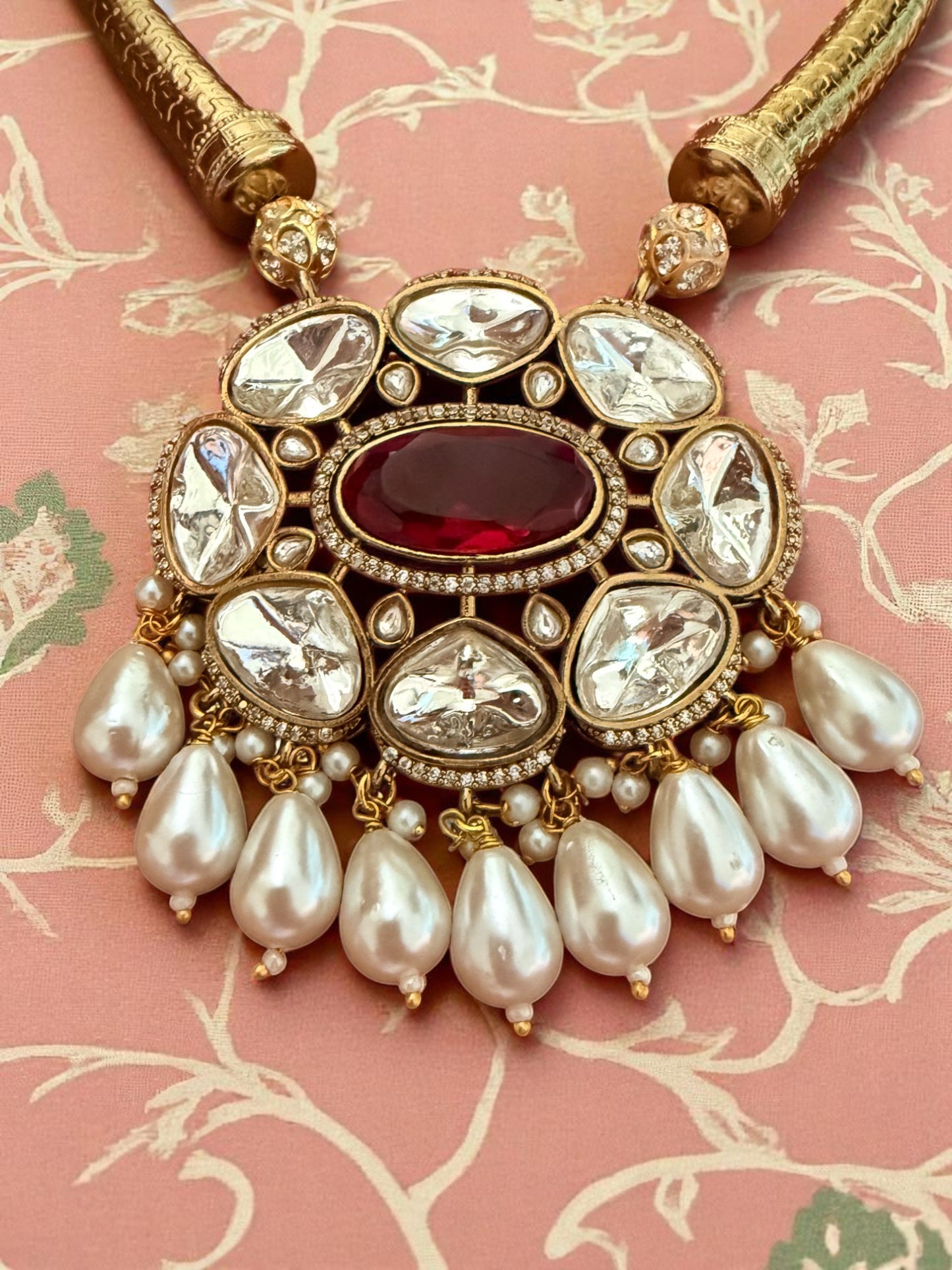 Regal Kundan Hasli Necklace Set with Ruby Red Centerpiece and Pearl Drop Accents