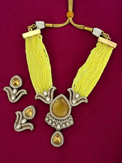 Rebekah Yellow beaded multistrand kundan necklace set with studded earrings