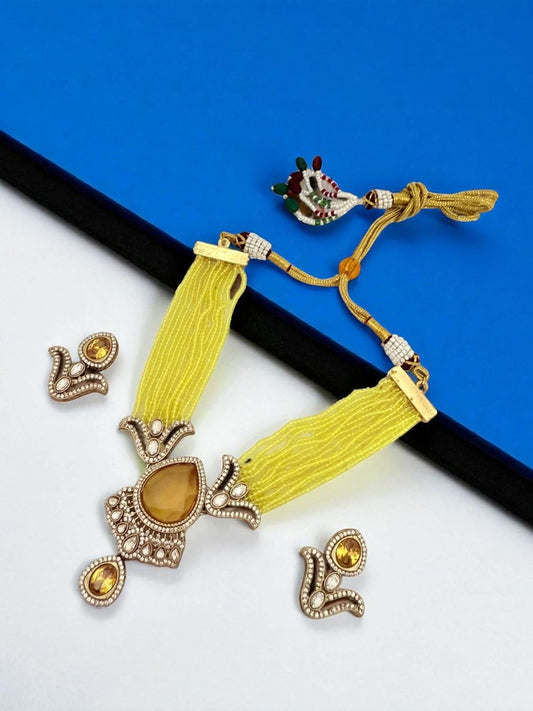Rebekah Yellow beaded multistrand kundan necklace set with studded earrings