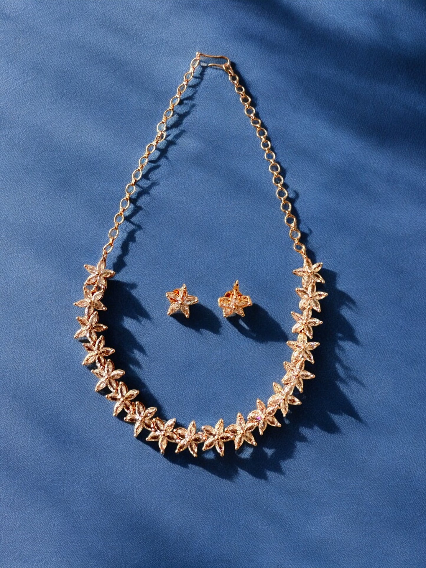 Gold-Toned Floral Necklace Set with Stone-Studded Detailing & Matching Stud Earrings – Festive Elegance Redefined