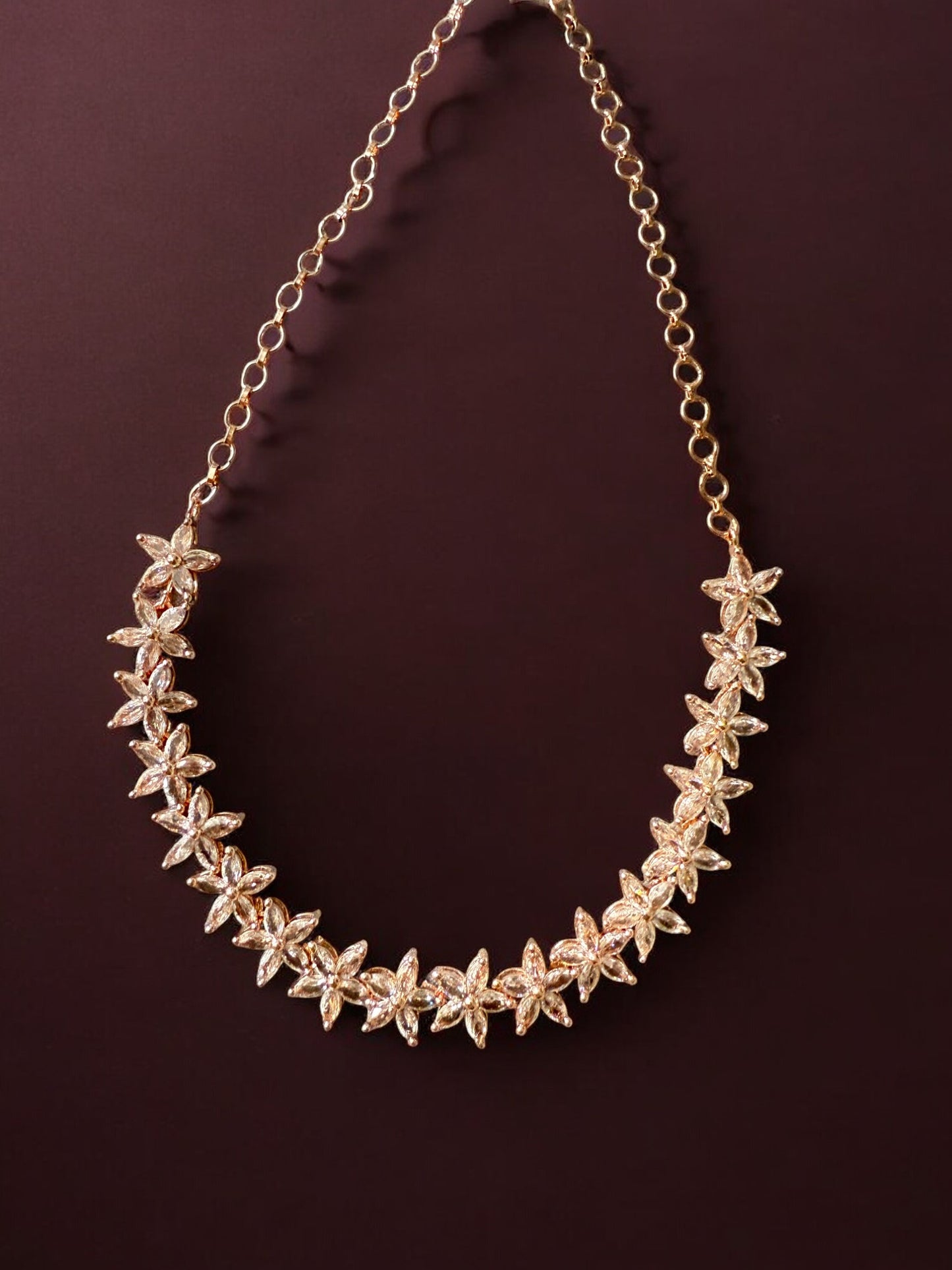 Gold-Toned Floral Necklace Set with Stone-Studded Detailing & Matching Stud Earrings – Festive Elegance Redefined