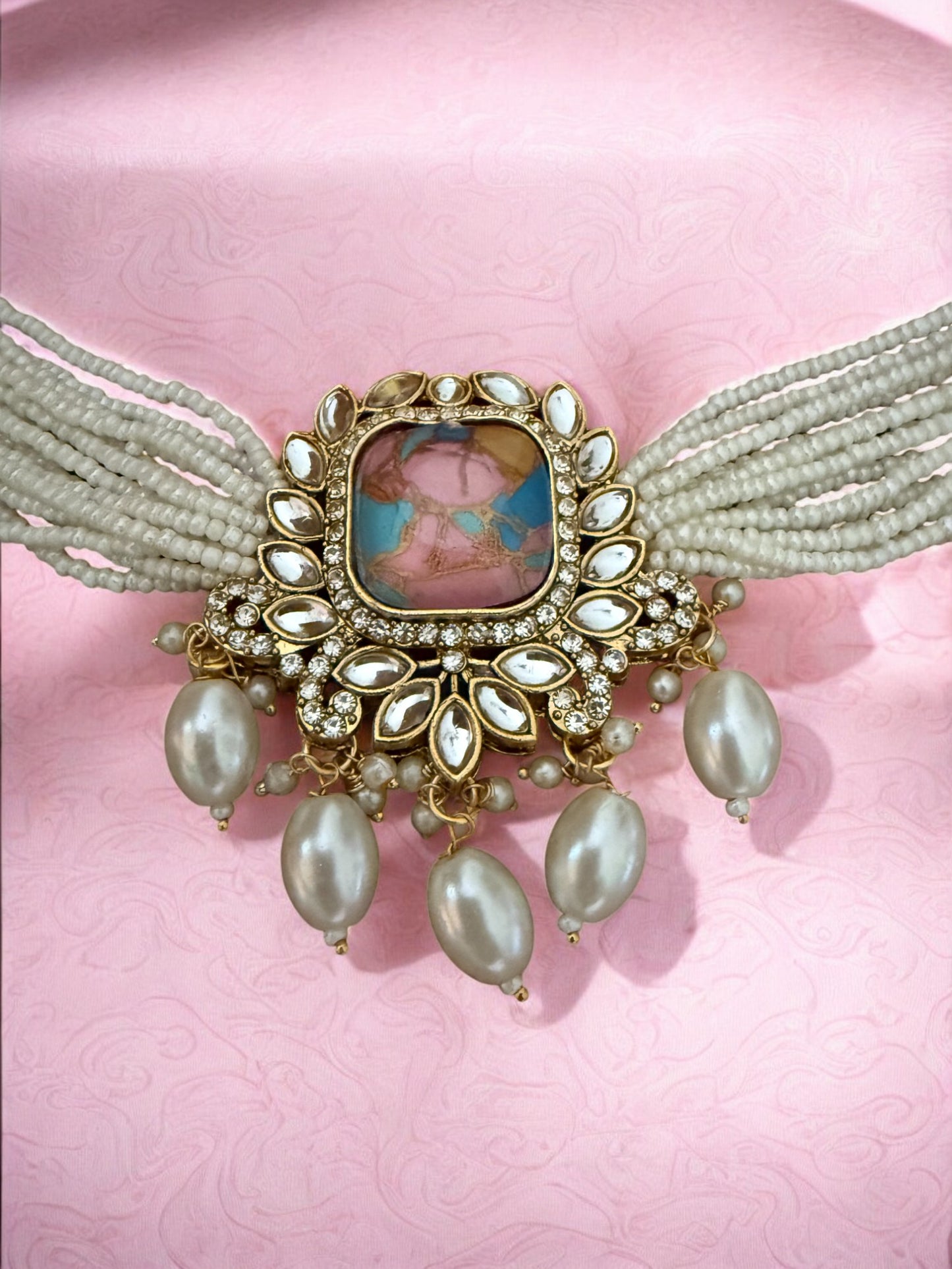 Pastel Pink Fire Stone Studded Multi Strand Pearl Kundan Choker Necklace Set with Matching Jhumkas