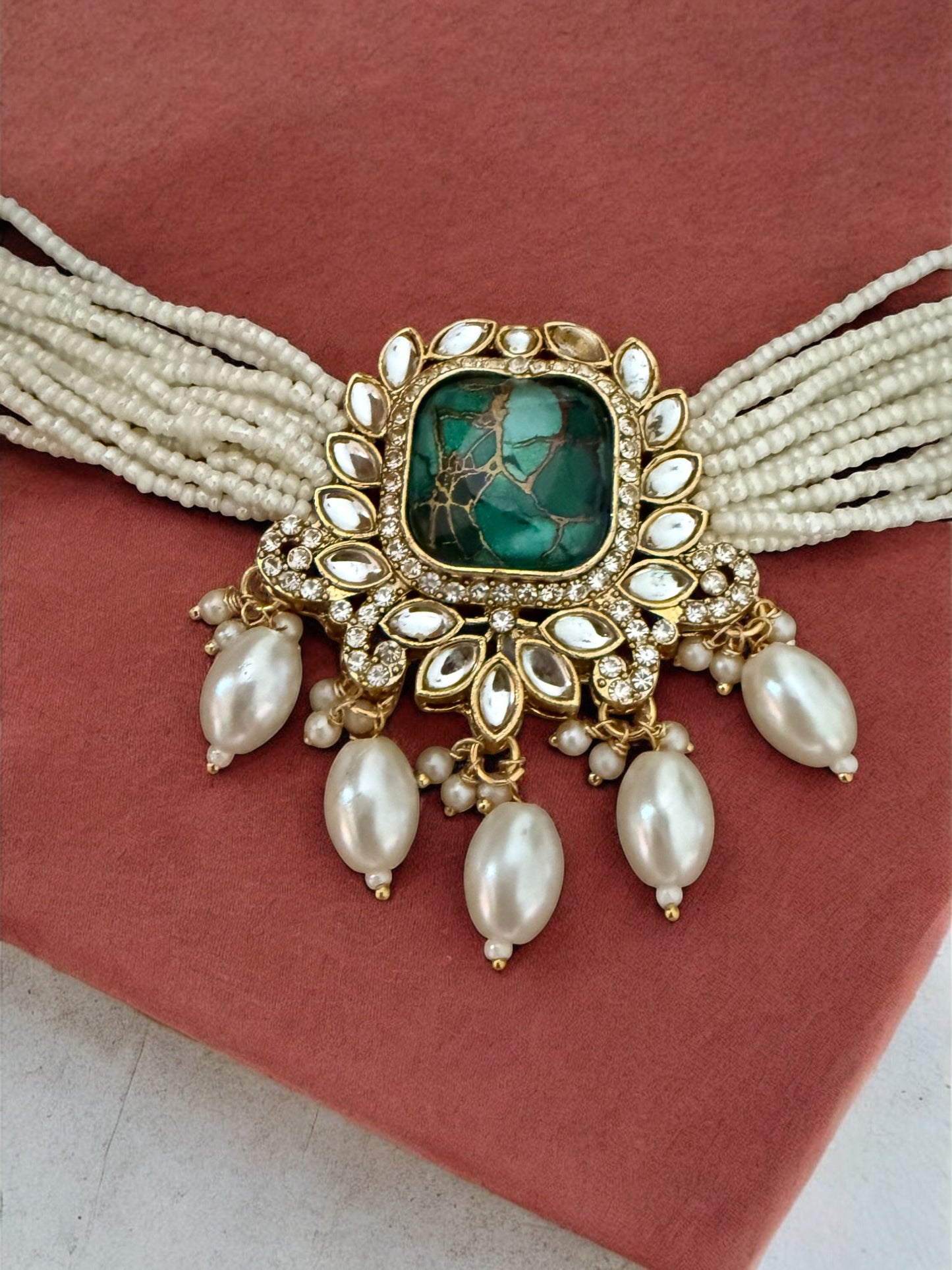 Emerald Fire Stone Studded Multi Strand Pearl Kundan Choker Necklace Set with Matching Jhumkas