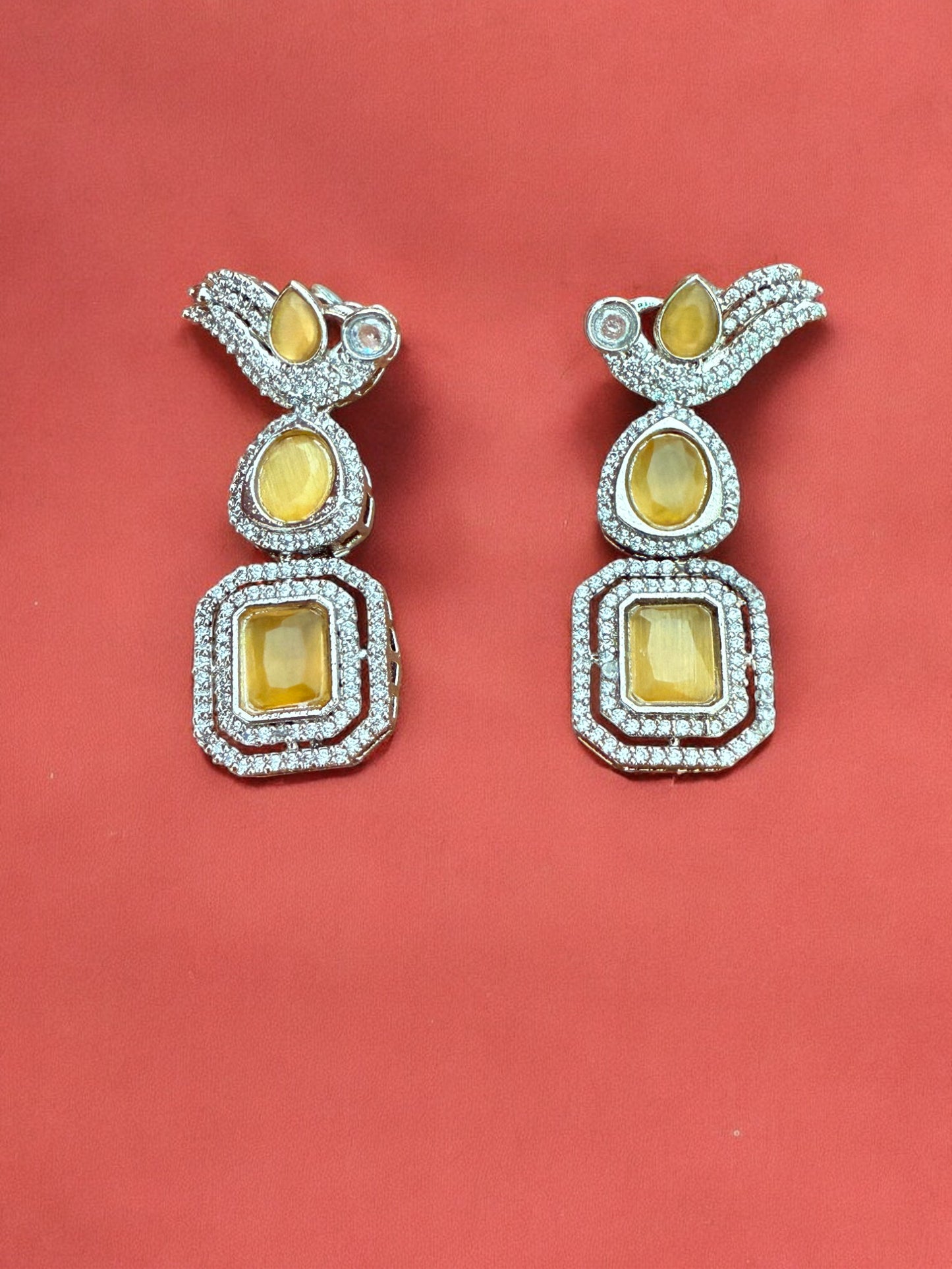 Silver Toned Cubic Zircon Earrings With Yellow Stones And Delicate Bird Motif Detailing