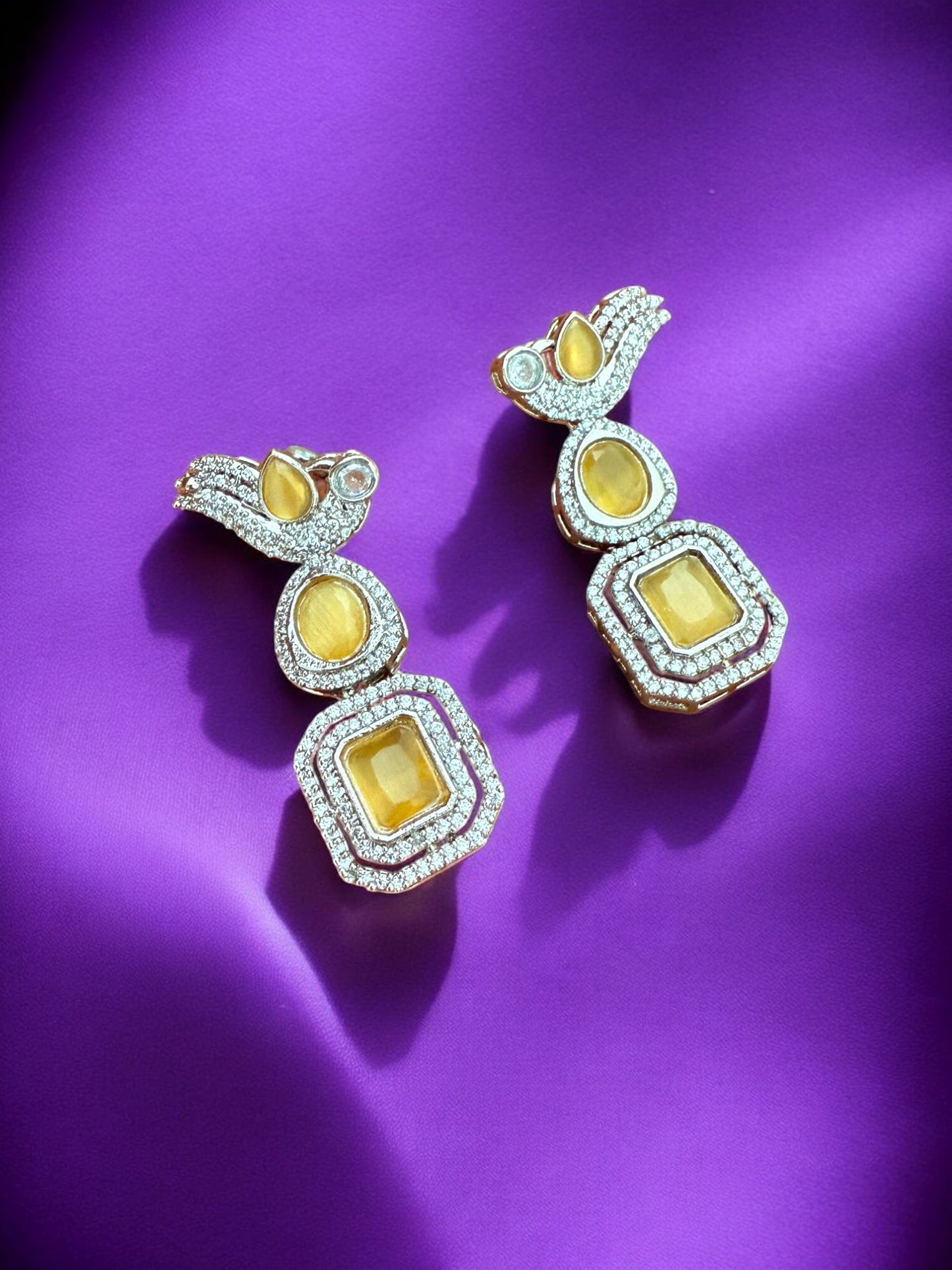 Silver Toned Cubic Zircon Earrings With Yellow Stones And Delicate Bird Motif Detailing