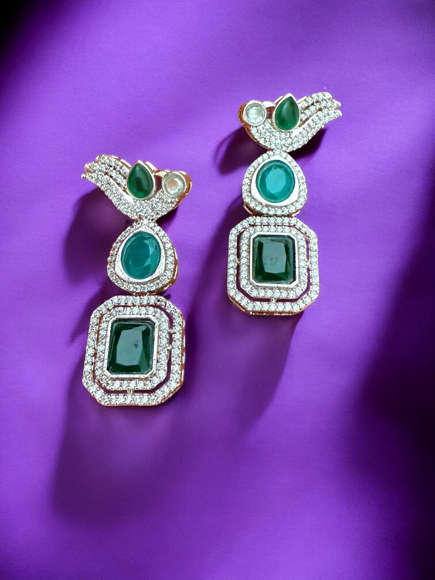 Silver Toned Cubic Zircon Earrings With Green Stones And Delicate Bird Motif Detailing