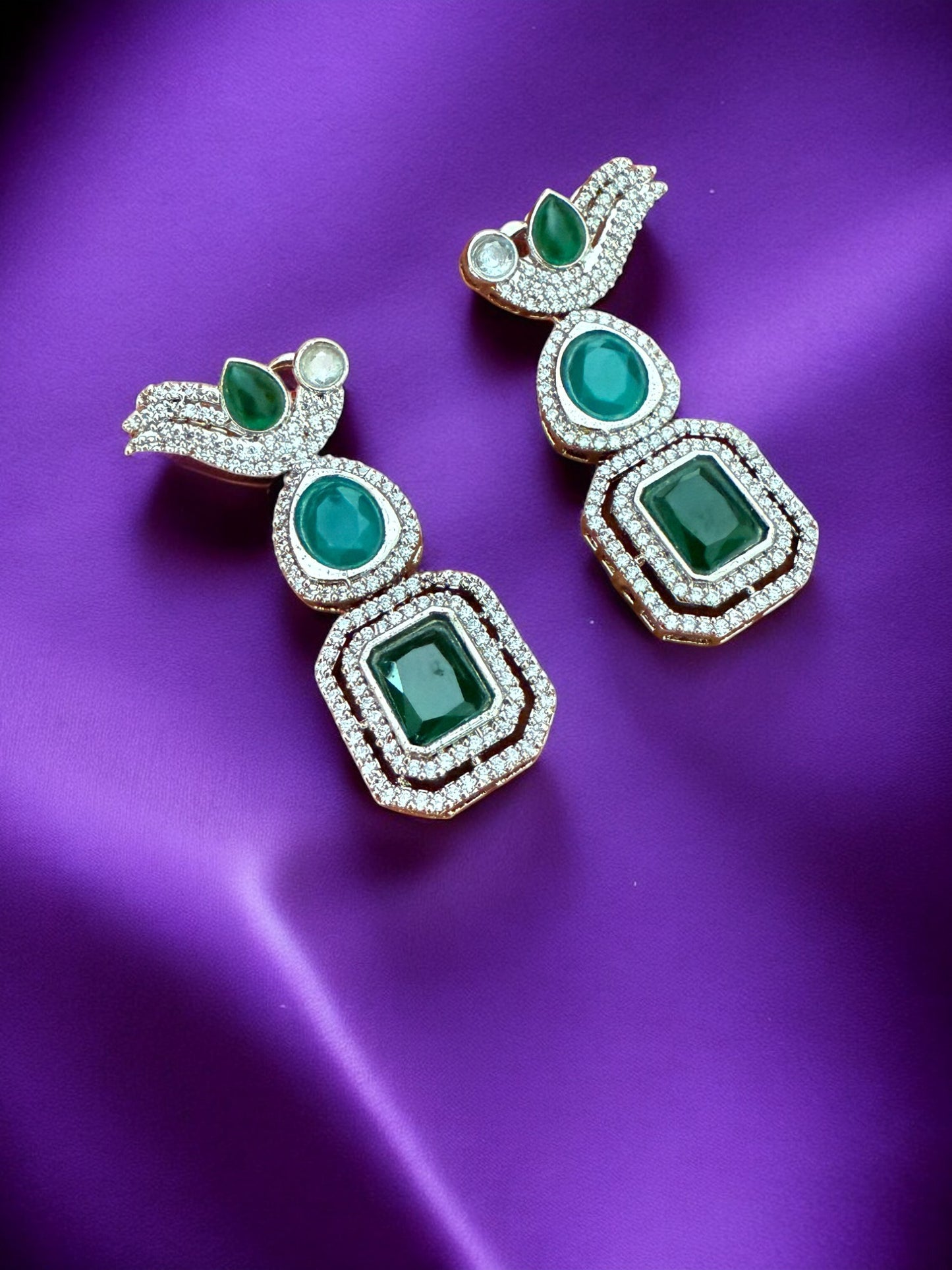 Silver Toned Cubic Zircon Earrings With Green Stones And Delicate Bird Motif Detailing