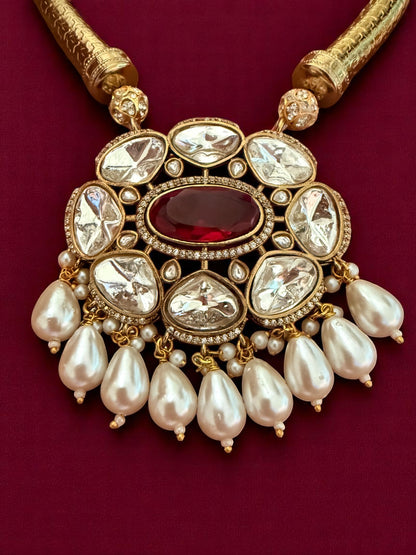 Regal Kundan Hasli Necklace Set with Ruby Red Centerpiece and Pearl Drop Accents