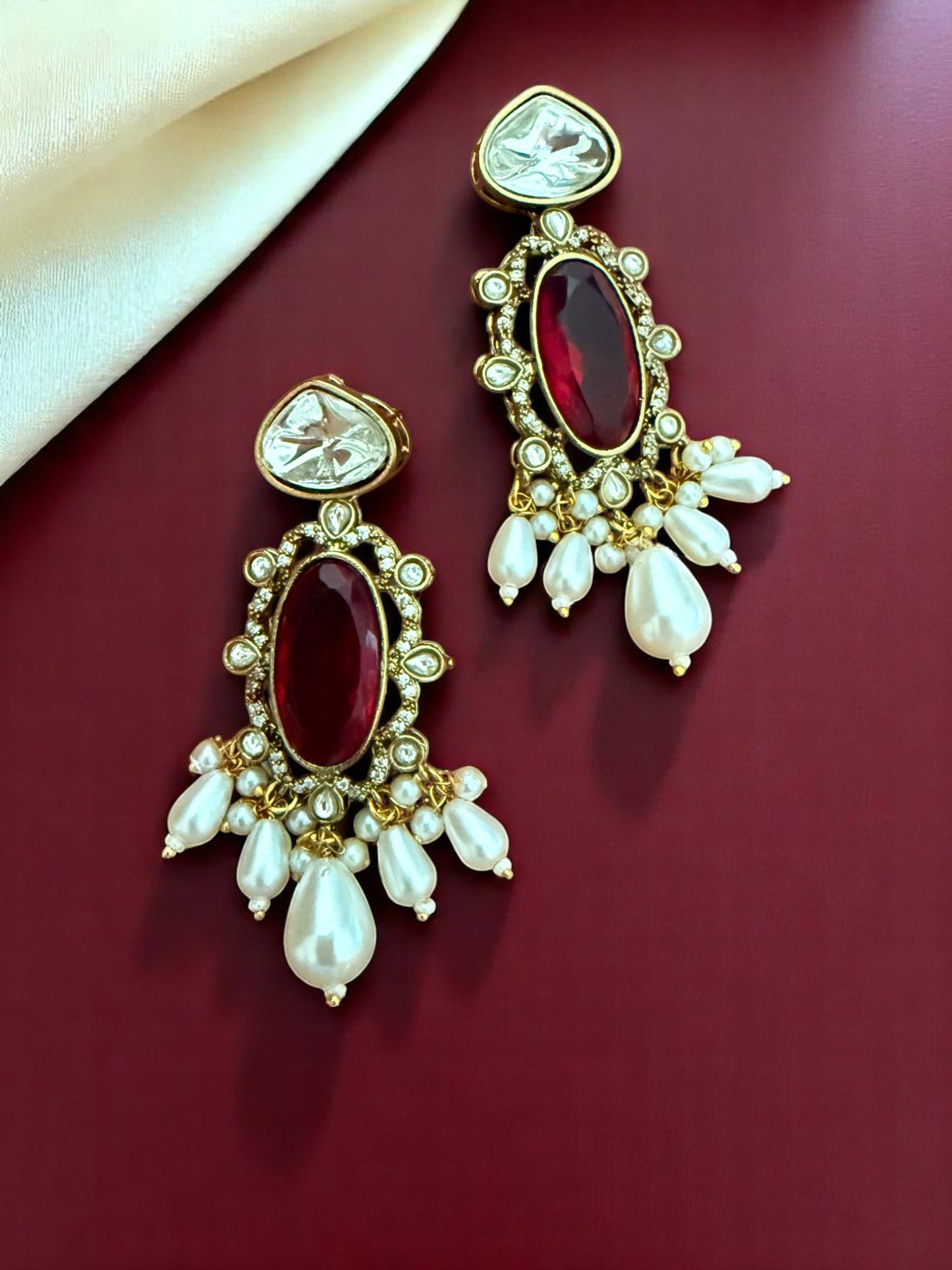 Regal Kundan Hasli Necklace Set with Ruby Red Centerpiece and Pearl Drop Accents