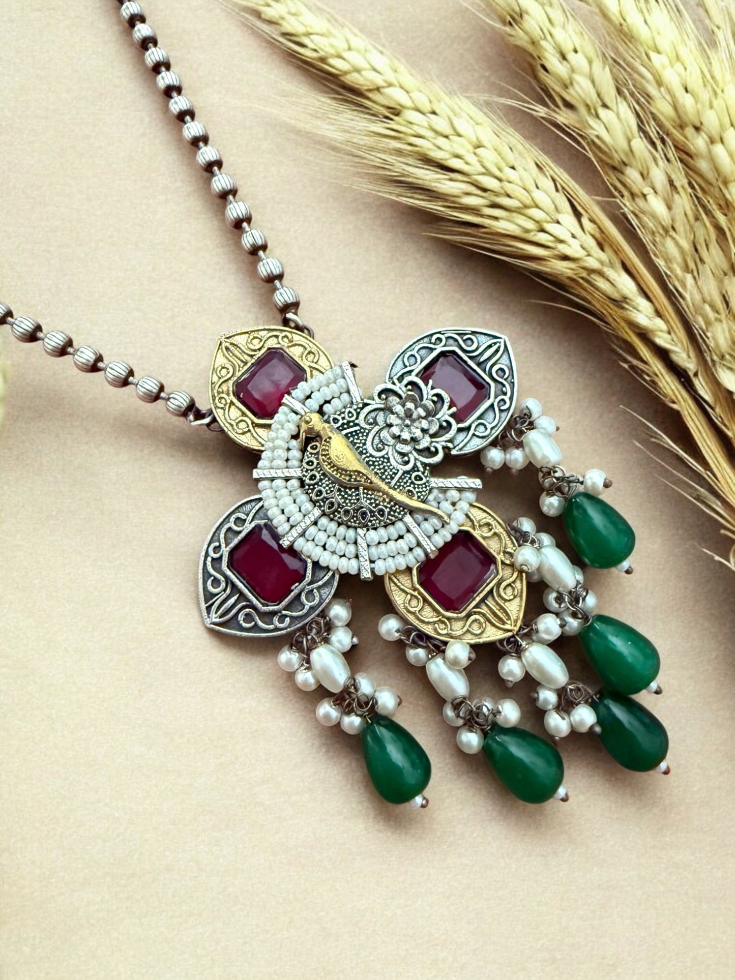 Peacock Elegance Oxidized Necklace Set with Ruby and Emerald Accents