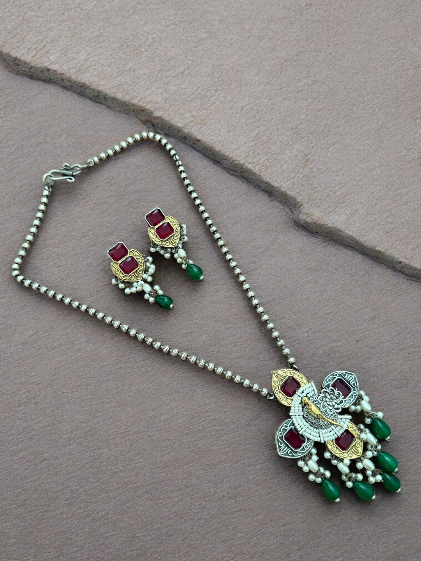 Peacock Elegance Oxidized Necklace Set with Ruby and Emerald Accents